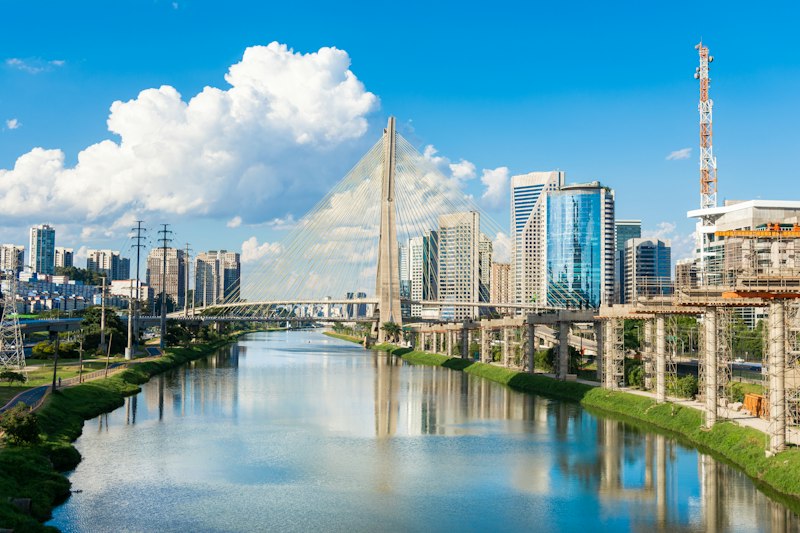 Office towers along the Pinheiros river in São Paulo, with the Ponte Estaiada